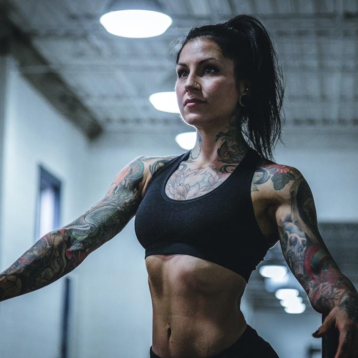 Interior of a professional gym with weight training equipment and mirrors